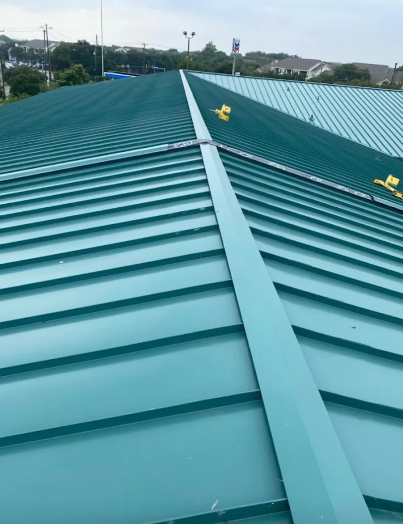 Green commercial metal roof ridge and valley for Metal Roof Repair in Woonsocket